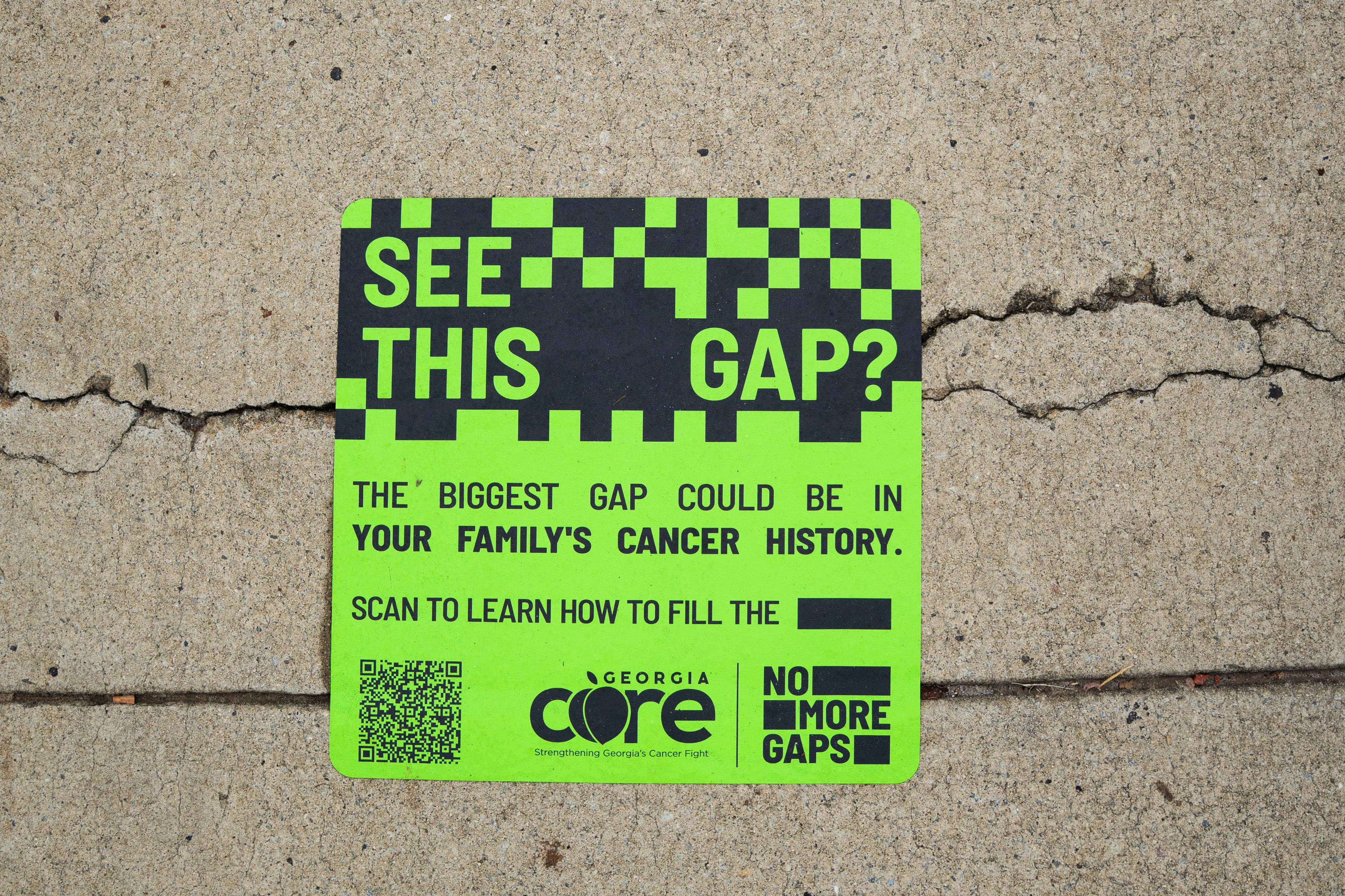 No More Gaps campaign decal on a chair in an outdoor setting